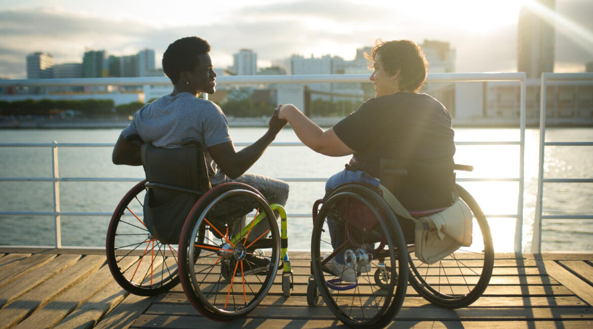 Fond Girlfriend Boyfriend Spending Day Together African American Man Caucasian Woman Wheelchairs Holding Hands Looking Sunset Love Affection Happiness Concept