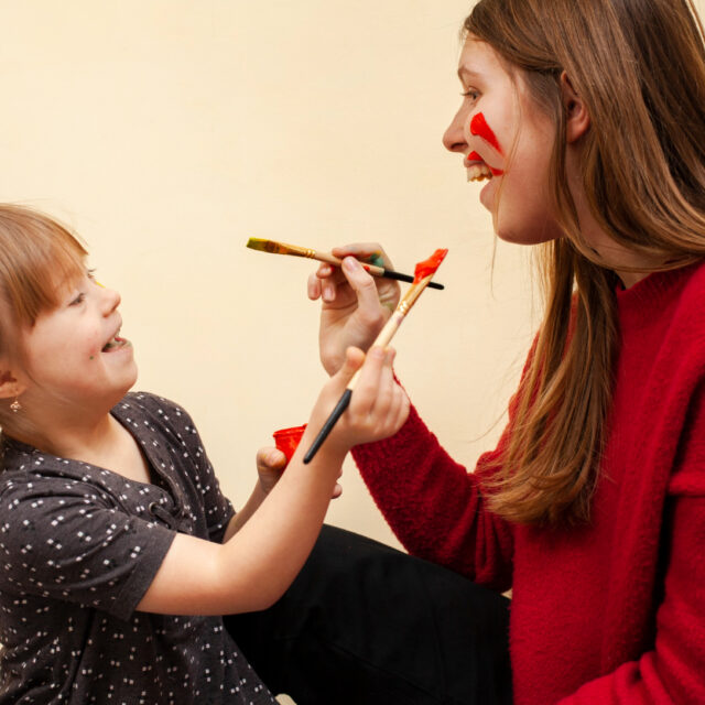 Happy Woman Girl With Down Syndrome Painting Each Other S Faces